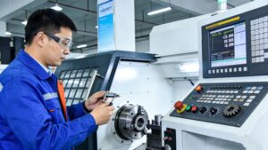 A technician using precision measuring tools to verify the dimensions of a newly machined helical gear next to a CNC machine.
